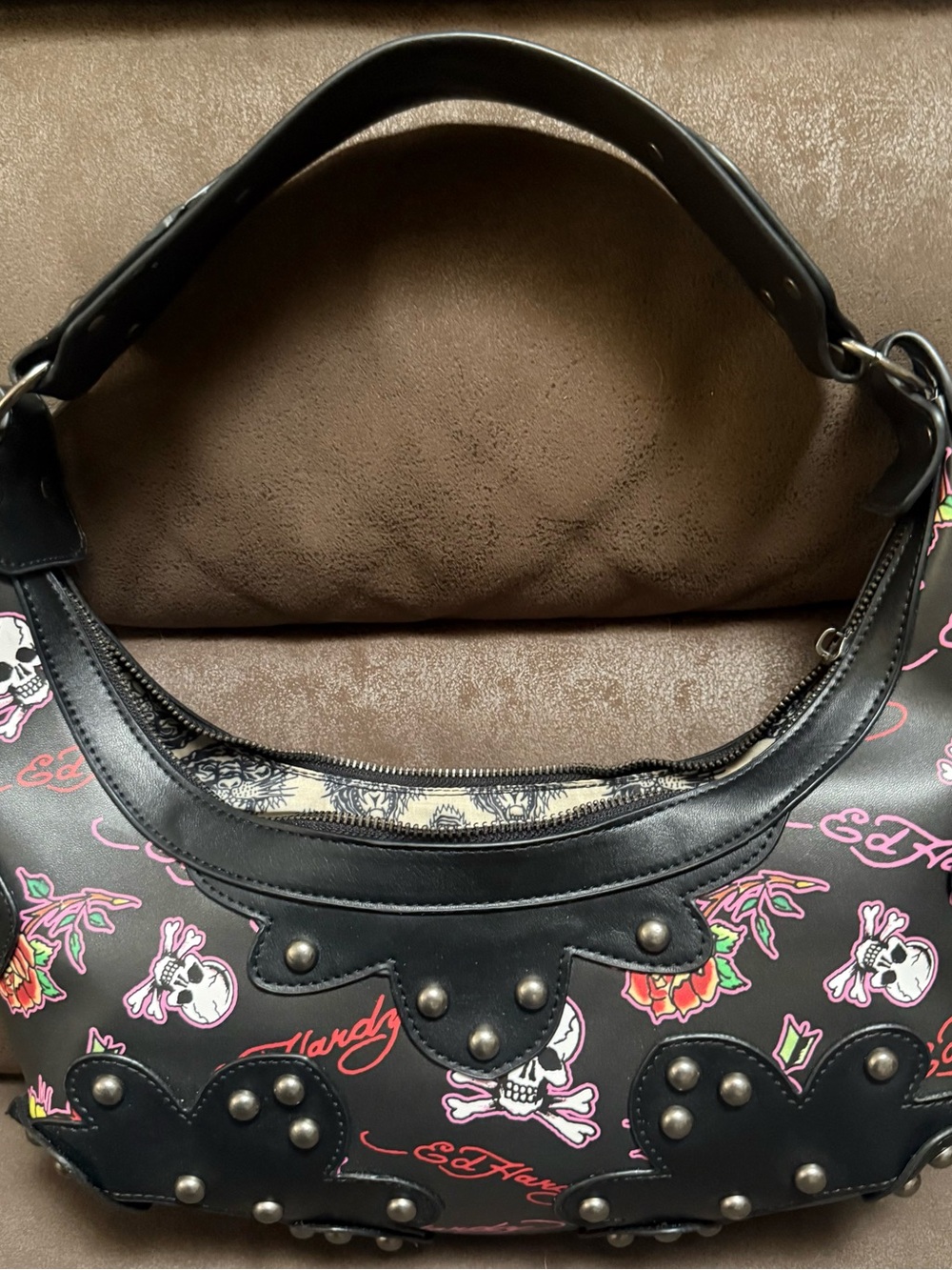 Signature Ed Hardy tattoo print Shoulder Bag with Skull, Rose & Pink accents.